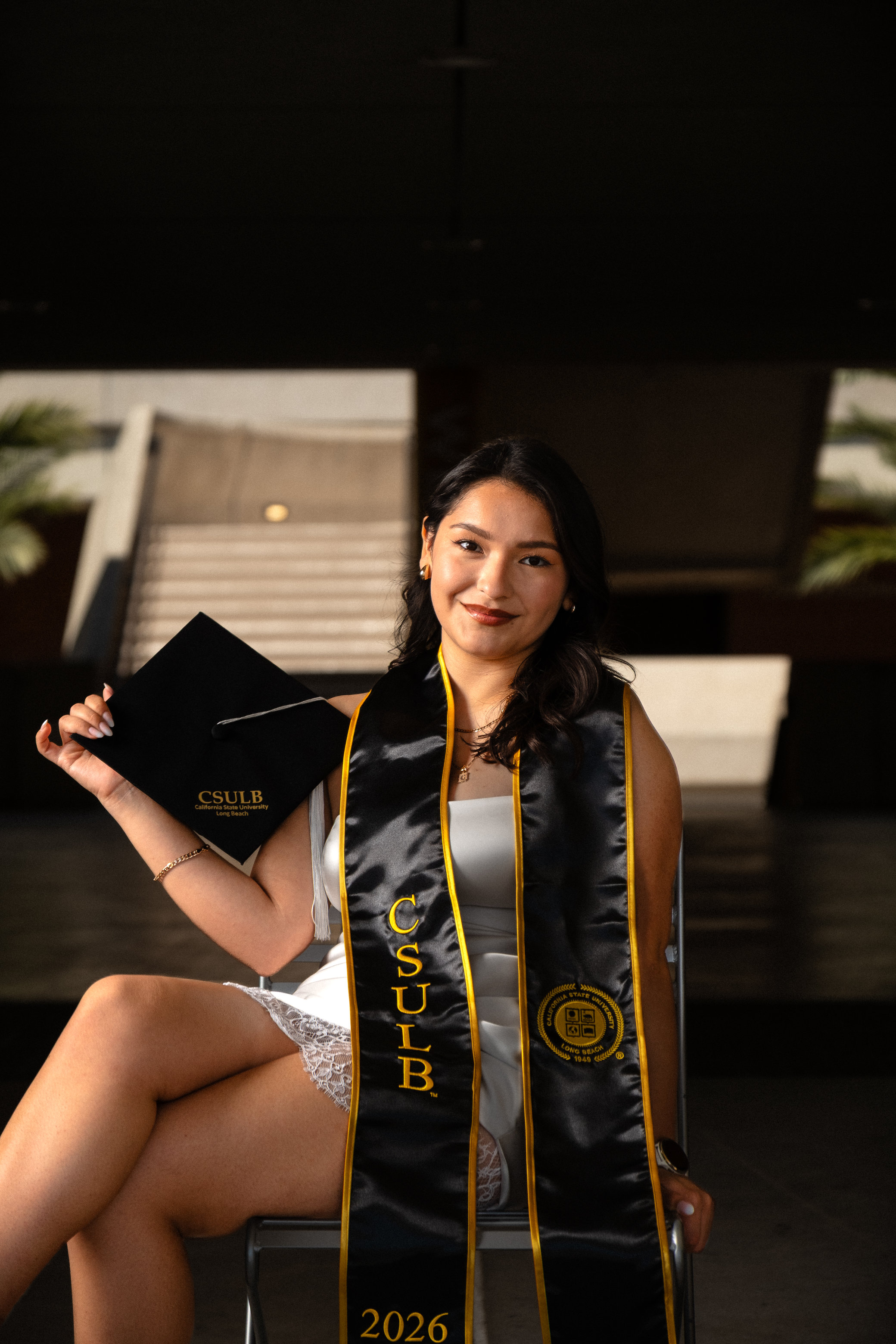 Graduate holding cap