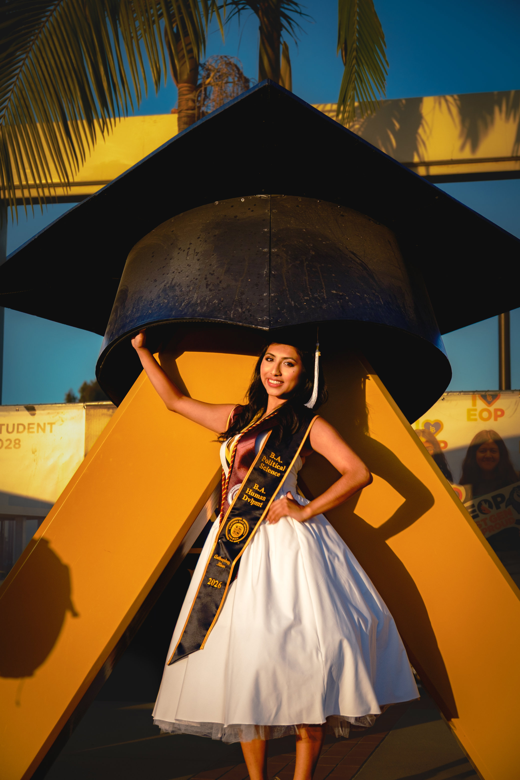 Woman standing under large cap