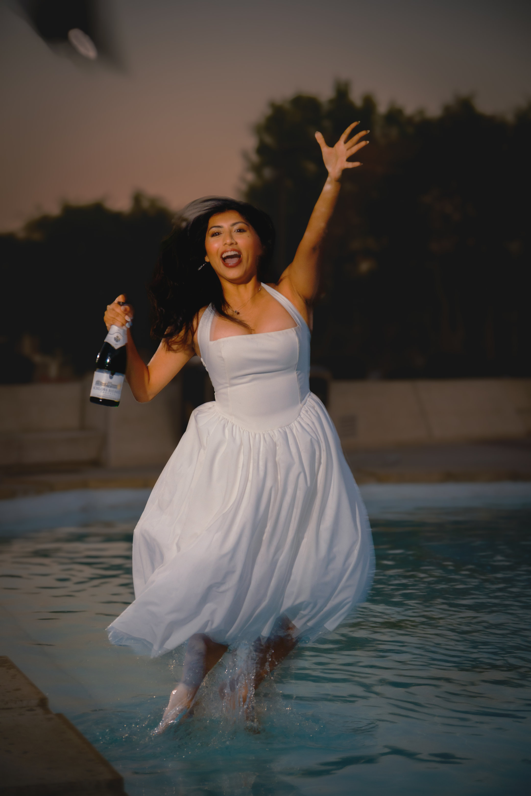 Woman leaping out of the water